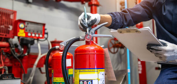 istock Engineer are checking and inspection a fire extinguishers tank in the fire control room for safety training and fire prevention. 2169727478