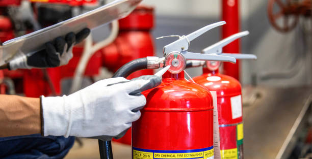 istock Engineer are checking and inspection a fire extinguishers tank in the fire control room for safety training and fire prevention. 2169727515