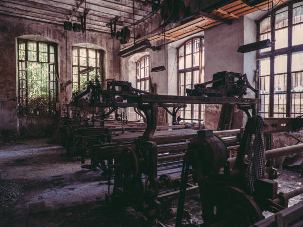 istock Shabby rusty looms in abandoned factory 2169727638