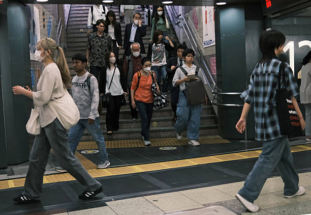 Tokyo May 15 2024: unidentified pedestrian wait the train in Shibuya. one of business zone in tokyo