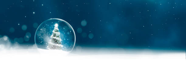 istock Snow globe with Christmas tree in blurred background with snowflakes 2169730550