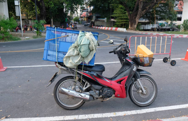 istock red moped with a blue box on the trunk 2169731719