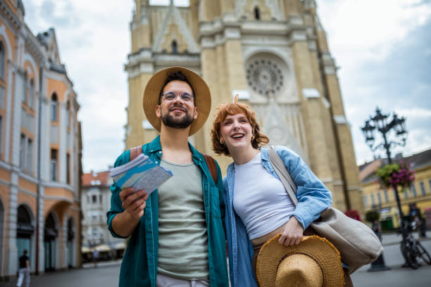 istock Young couple using a map to explore the new city on their vacation. 2169734877