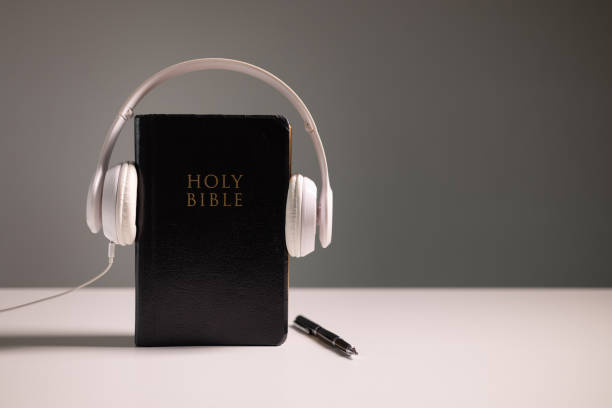 istock Reading the Holy Bible on a cellular device showcases how technology integrates with Christian practices, making the sacred book accessible beyond paper in both personal and business contexts. 2169736355