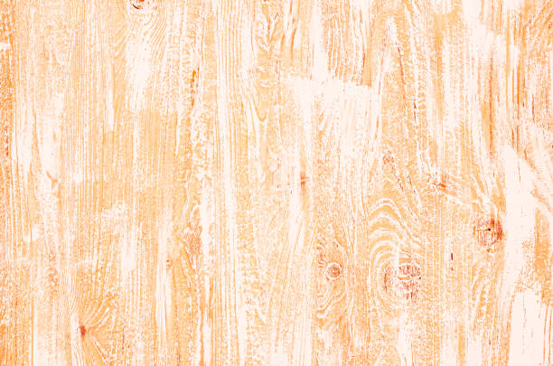 Light orange wooden background with wood structure, with knots and with vertical white and orange stripes for wallpaper, graphic design, creativity.