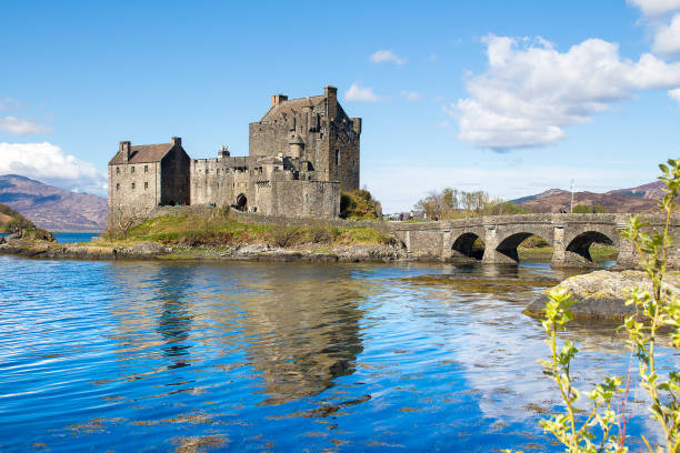 Eilean Donan, Scotland - April 28,2024 - Tourist at the famous Eilean Donan Castle in the highlands, Scotland