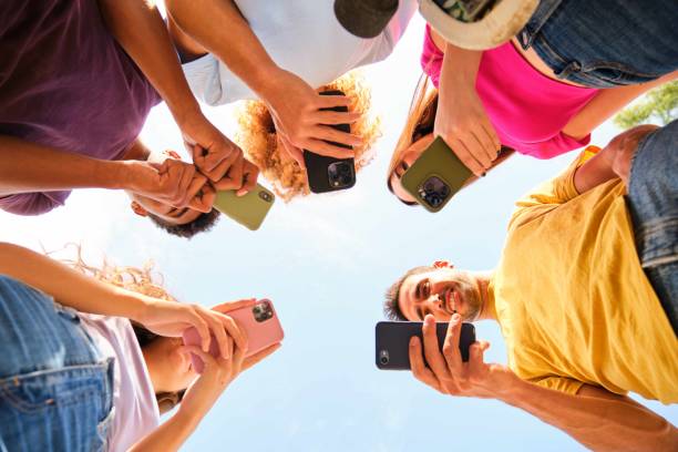 istock Joyful student friends looking at phone screen enjoying social media content. 2169741325