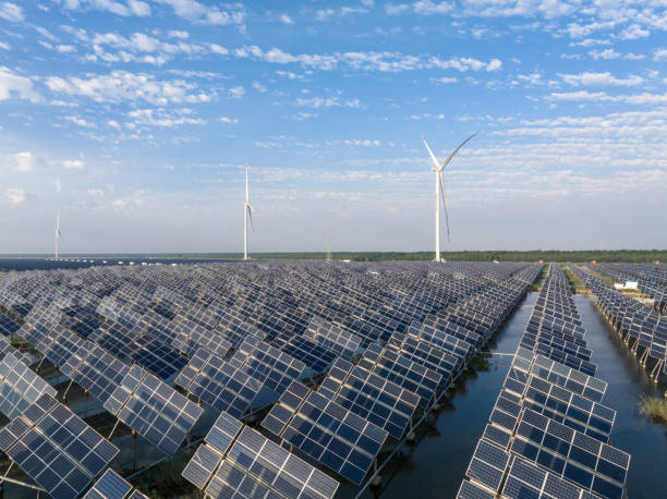 istock solar power station and wind mill 2169743022