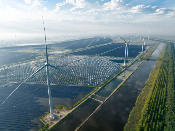 istock solar power station and wind mill 2169744219