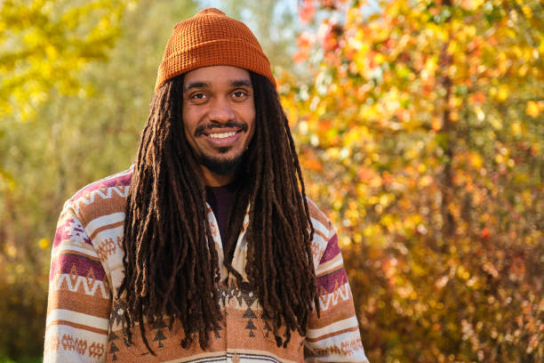 istock African young man with dreadlocks smiling and looking at camera in fall. 2169744694