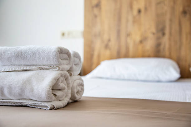 istock Clean towels on the bed in the hotel room. Selective focus 2169746007
