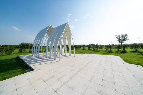 abstract building in meadow with blue sky
