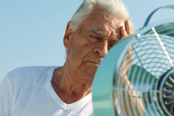 istock Elderly Man with Fan 2169748508