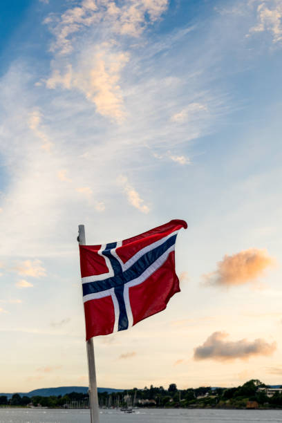 Norwegian flag, a flag of Norway with sunset background.