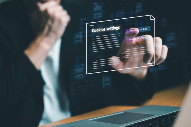 istock hand using computer laptop while choose to accept internet cookies policy or reject. Customer data privacy concept that allow web browser to collect user data to resell or use for marketing purpose. 2169752727