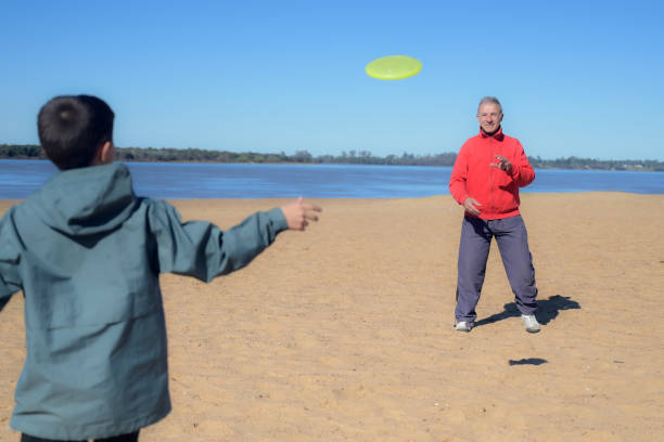 A man tossing a Frisbee.