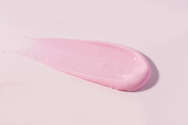 istock Macro smears of multi -colored paint on a pink background 2169756534