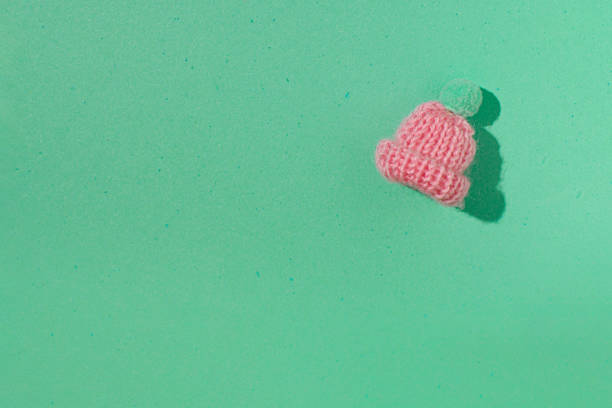 Winter holidays, minimal conceptual pastel pink and mint green layout.