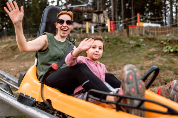 istock Mother and daughter on the alpine coaster having fun. 2169767702