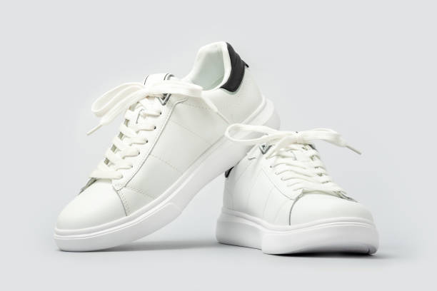 istock White leather sneakers on gray background 2169767851