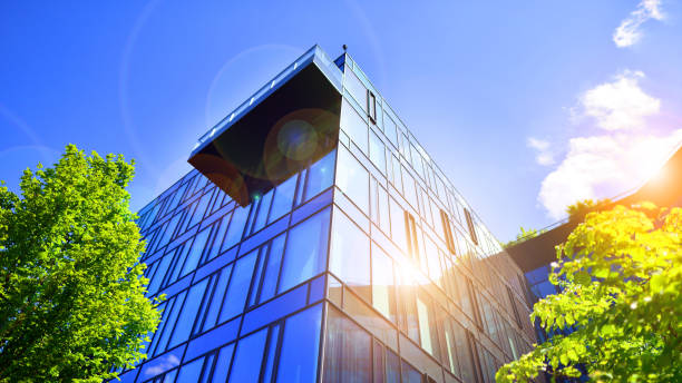 istock Sustainable glass office building with trees for reducing carbon dioxide. 2169768695