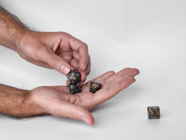 istock Hands holding polyhedral dice for dungeons and dragons game session 2169768996