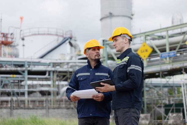 istock Petroleum engineers working at oil refinery site 2169770443