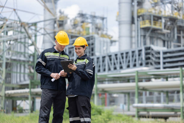 istock Petroleum engineers working at oil refinery site 2169770459