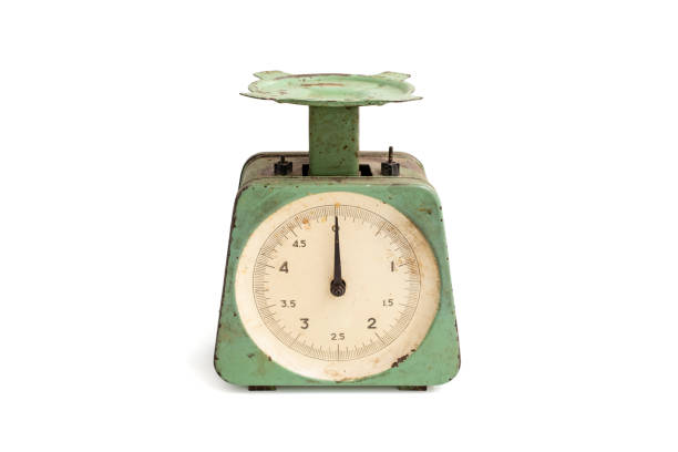 istock Obsolete vintage kitchen scale, with rust spots and green peeling paint, isolated on white background 2169776613