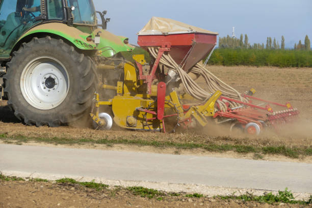 istock Work on a field with modern agricultural implemen 2169782694