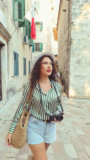 istock Woman Tourist Exploring Old Town 2169789744