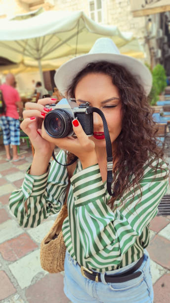 istock Tourist Taking Photo With Vintage Camera 2169789797