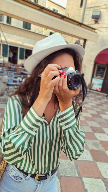 istock Tourist Taking Photo With Vintage Camera 2169789801