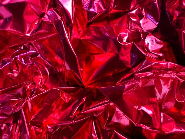 istock red shiny crumpled foil background 2169794167