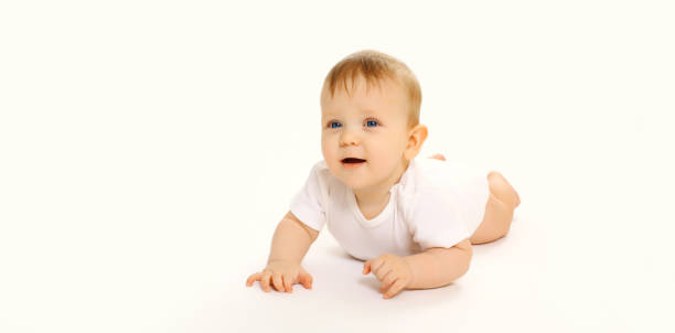 istock Happy cute baby crawling on the floor on white studio background 2169794641