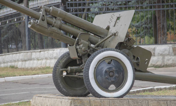 istock Old Soviet anti-aircraft gun with white wheels on the street in a post-Soviet style 2169795212
