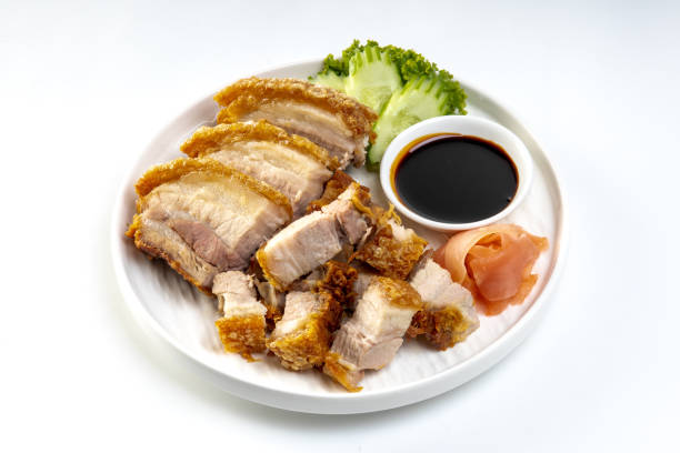 istock Crispy pork belly in white plate isolated on white background 2169795853