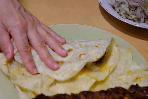 istock A housewife makes Adana kebab wrap 2169798734