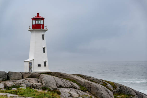 istock Peggy's cove lighthouse on a rainy day 2169798815