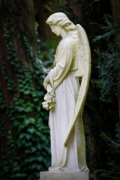 istock white angel sculpture in a cemetery 2169802113