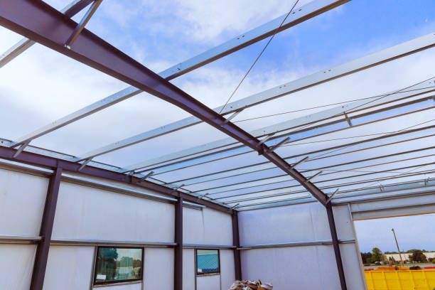 istock Metal frame for a new barn is being constructed with steel construction 2169809173
