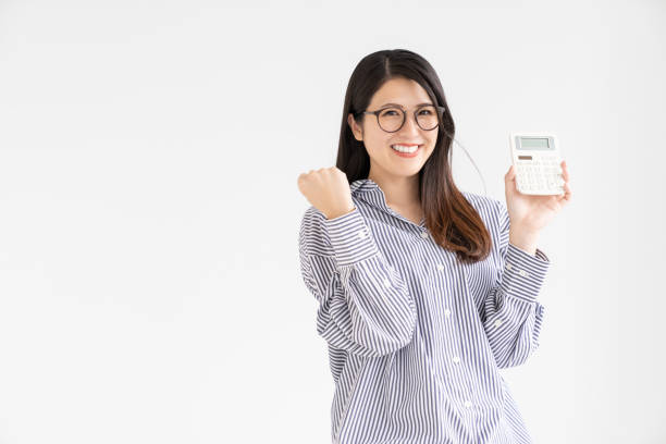 istock attractive Asian woman having an electronic calculator,smile 2169810565