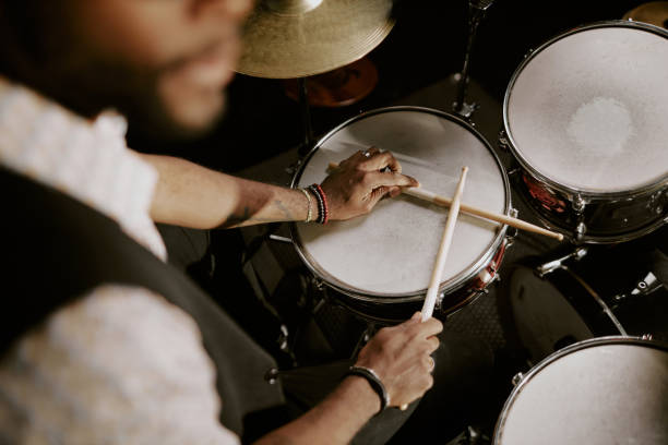 istock Black Man Sitting At Drum Kit 2169813160