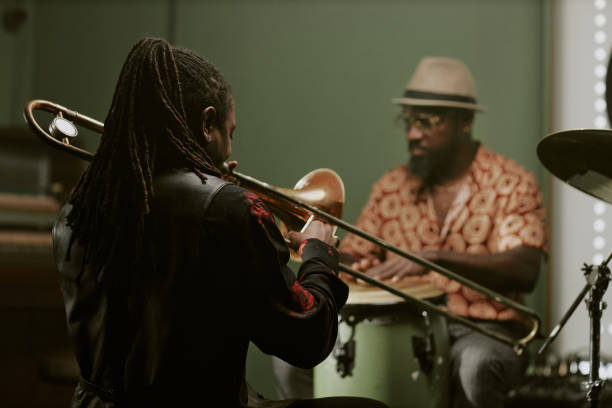 istock Man With Long Dreadlocks Playing In Band 2169813571