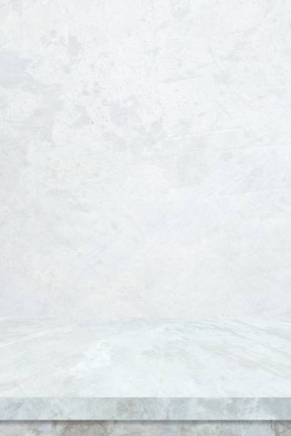 istock Empty white marble table over white cement wall background, Vertical white shelf, counter for food and product display montage backdrop, Table top, desk surface banner, mockup, template 2169813817