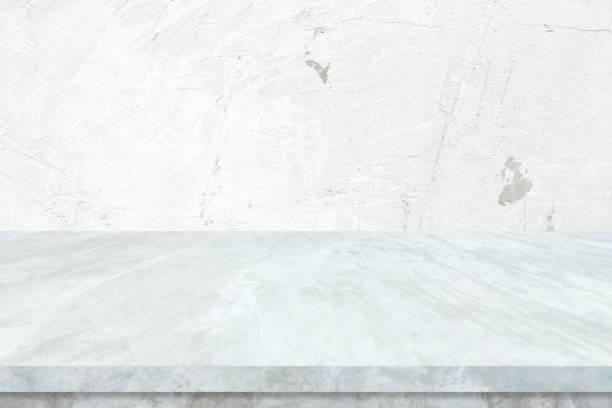 istock Empty white marble table over white cement wall background, White shelf, counter for food and product display montage backdrop, Table top, desk surface banner, mockup, template 2169813845