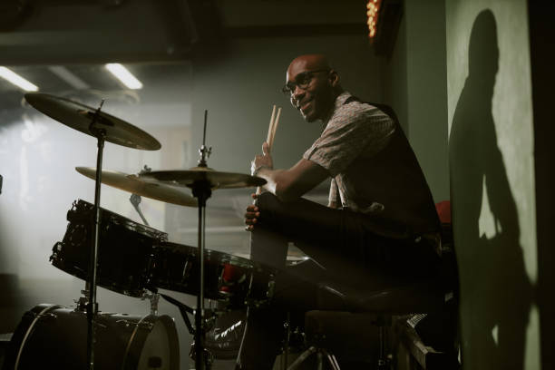 istock Confident Young Man Sitting At Drum Kit 2169814027