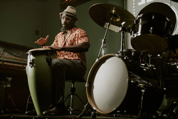 istock Black Man Playing Tumbadora on Stage 2169814240