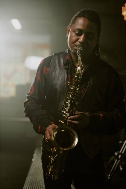 istock Black Man Playing Sax In Bar 2169814343