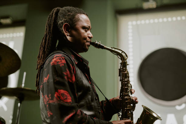 istock Man With Long Dreadlocks Playing Jazz On Sax 2169814608